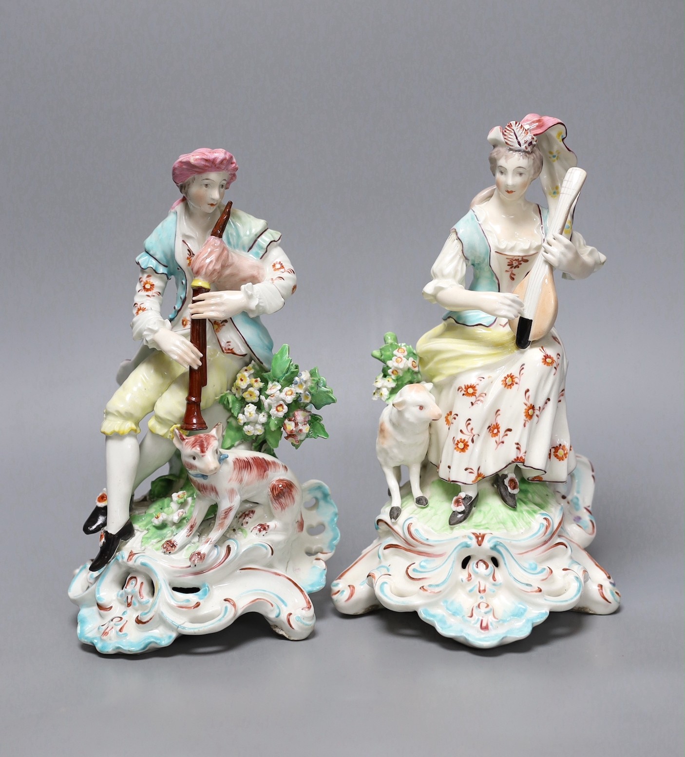 A pair of Derby figures of musicians, c.1775, Female musician 22.5 cms high